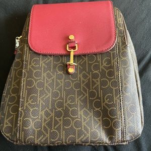 Calvin Klein back pack purse in signature CK print-Like New!
